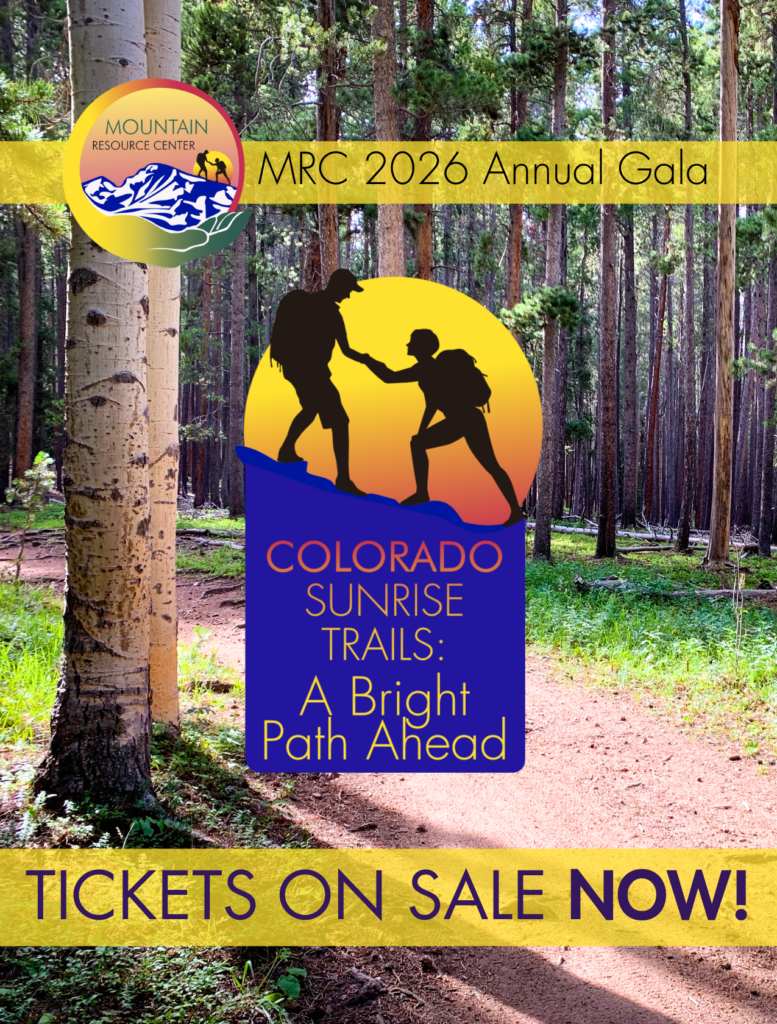 An image with a picture of a local trail with aspen and lodgepole pine trees. In front of the picture is a band of slightly transparent yellow with the MRC 2026 Gala logo and the words 2026 MRC Annual Gala. In the middle of the image is the logo for the event, which features vga images of one hiker helping another up a steep mountain in front of a large red and yellow sun, and then a blue box below reading Colorado Sunrise Trails: A Bright Path Ahead in a text gradient starting red at the top and shading to yellow. Below that is another yellow band with the words Tickets on Sale Now!