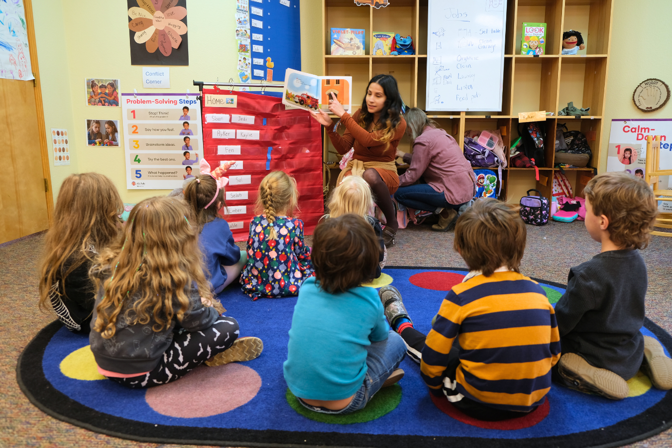 A teacher reads to kids in our preschool classroom.